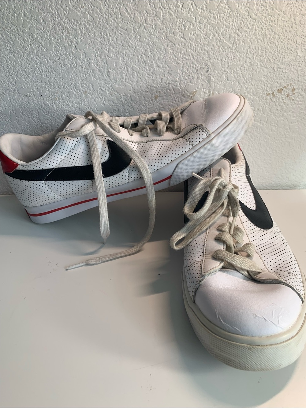 Men’s White Perforated Sneakers with Black Accent and Red Trim